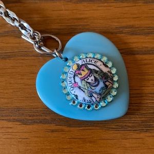 Tarina Tarantino Alice in Wonderland necklace. Like new. Chain is silver tone